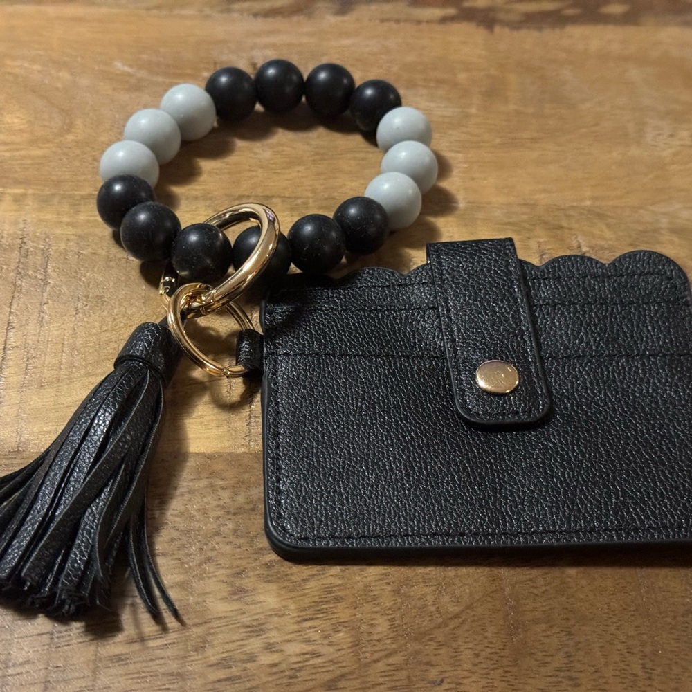 Black and gray beaded keychain with wallet and tassel